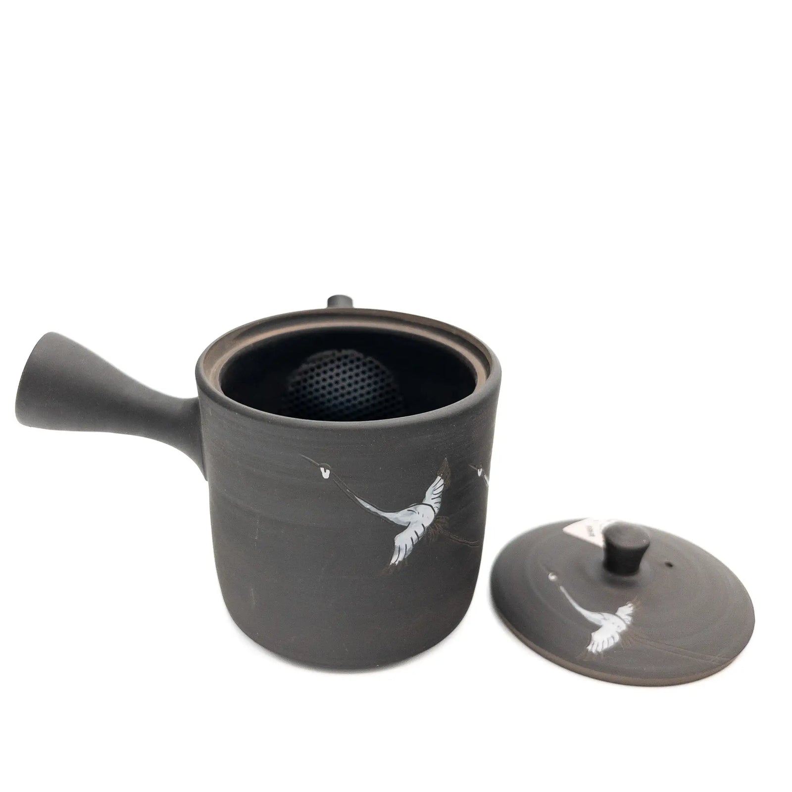 Black ceramic teapot with lid on a white background
