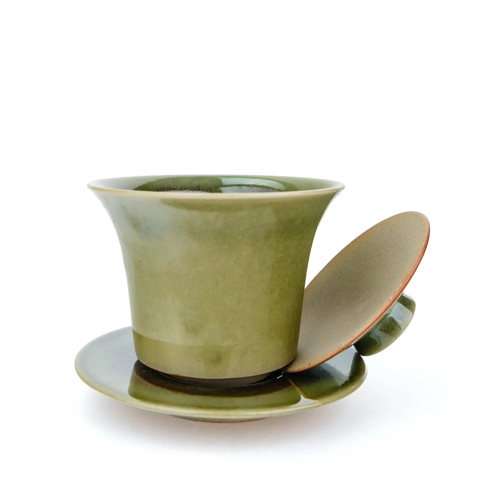 Handmade gaiwan with a green glaze. Photo shows the lid off the bowl.
