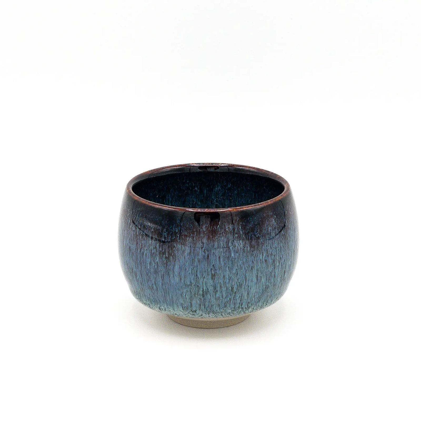 Blue ceramic cup on a white background