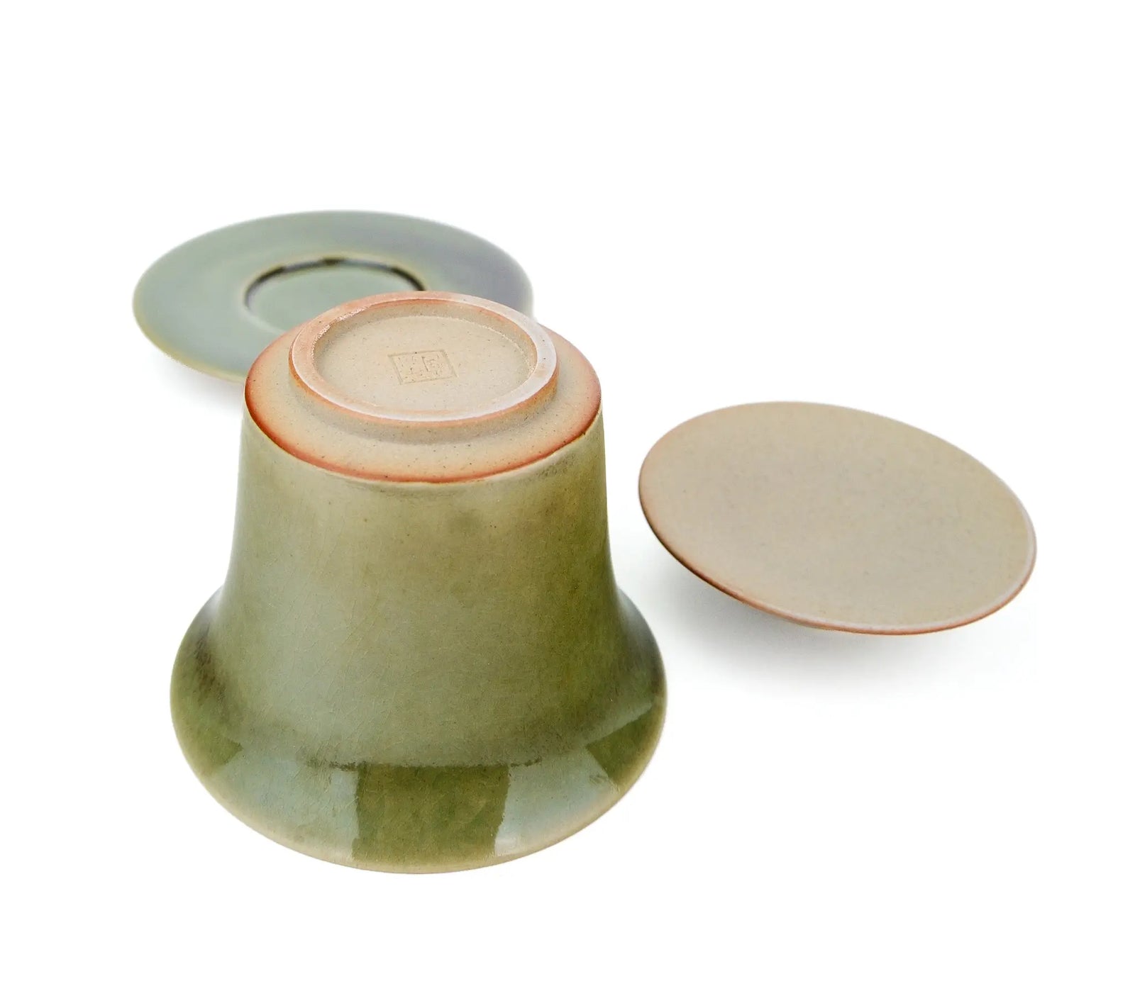 Huaning gaiwan #426 bowl upside down beside its saucer and lid, showing the unglazed base and stamped seal