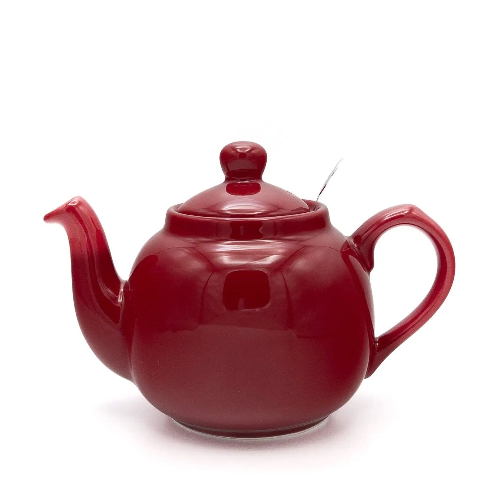 Red teapot on a white background