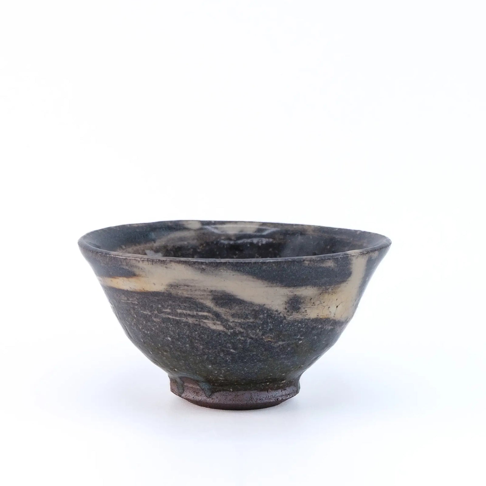 Black and white marbled ceramic tea cup on a white background