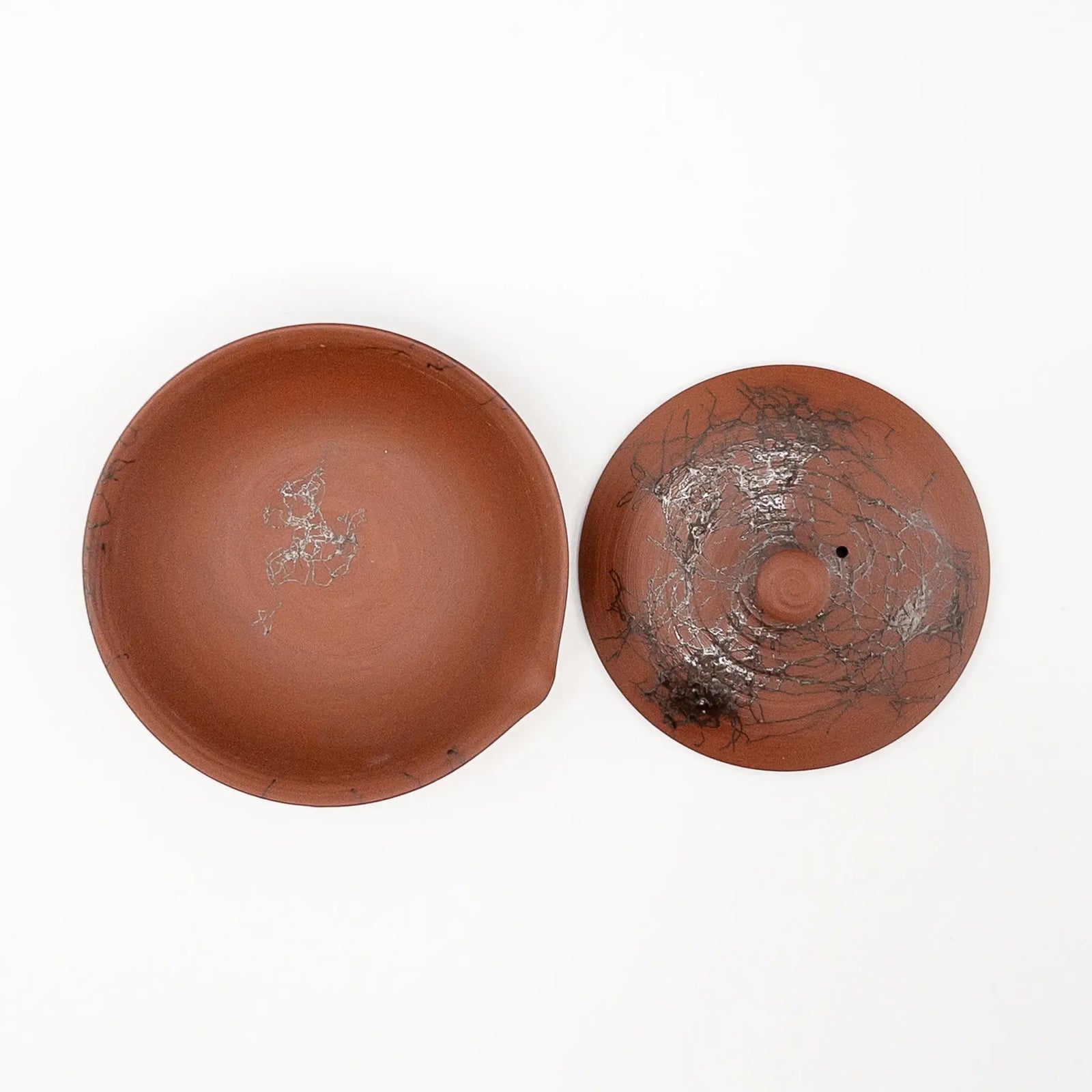 Overhead view of the shiboridashi showing the wide shallow bowl and the pouring lip formed in the rim
