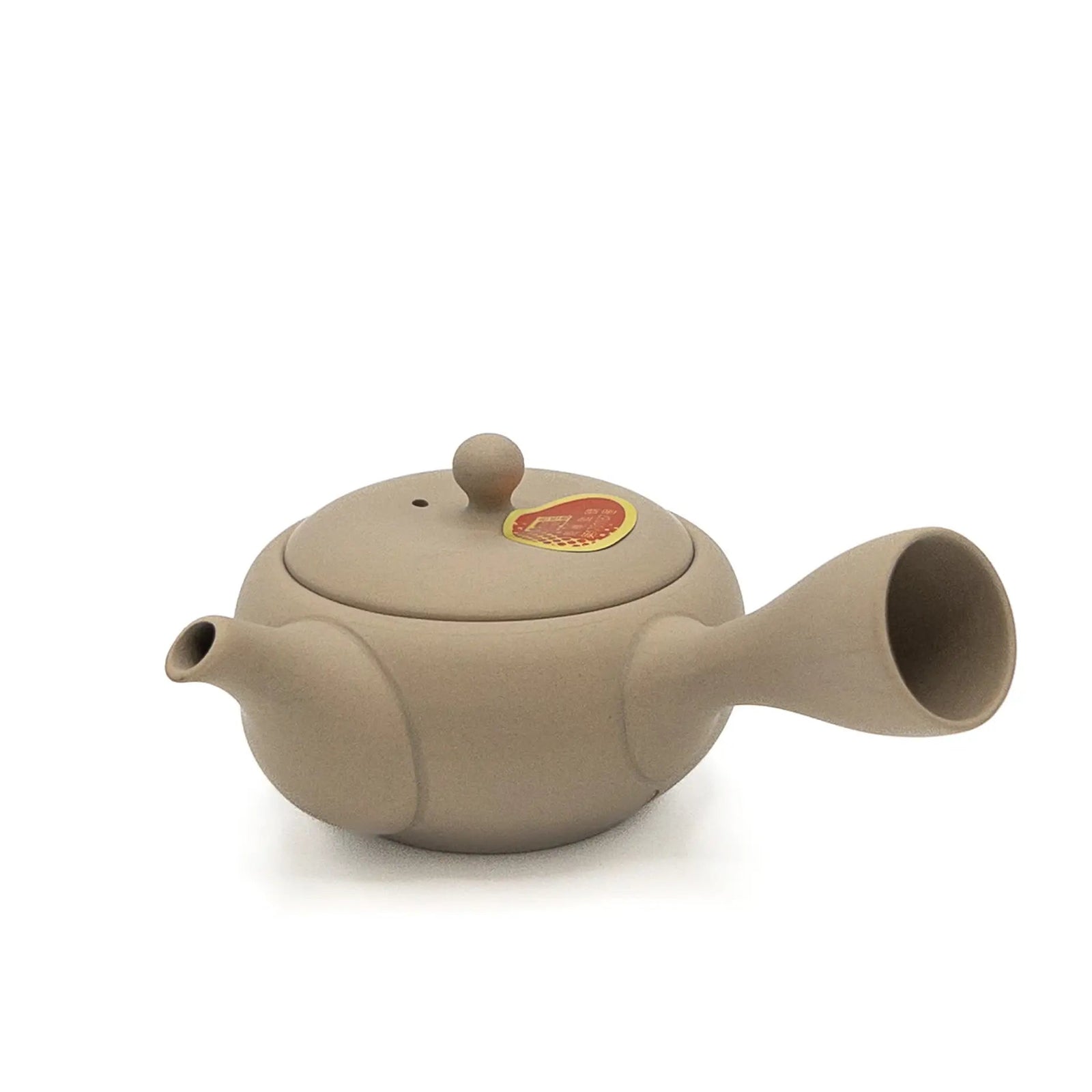 Beige Japanese teapot on a white background
