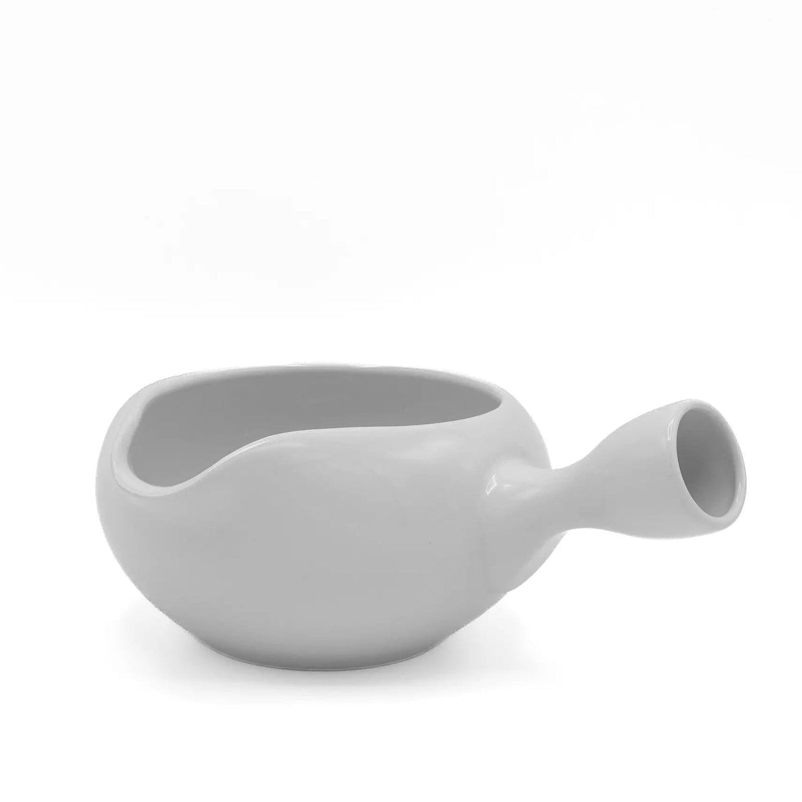 Side view of the white yuzamashi showing the low bowl and the hollow handle