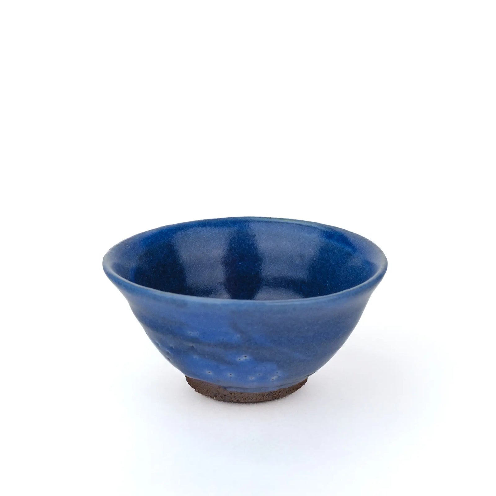 Mark Mohler gong fu cup #2Q from a raised angle showing the blue glaze inside and the pinholed side of the cup