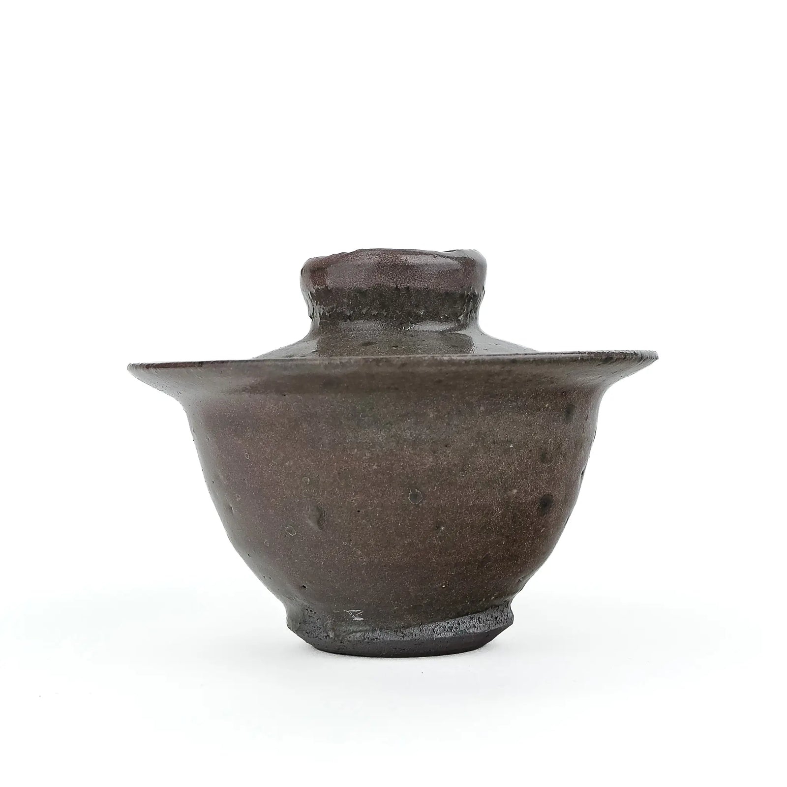 Mark Mohler handmade gaiwan #10, about 100 ml, at eye level with the lid on, in a speckled dark brown glaze with a wide flared rim and a dark foot