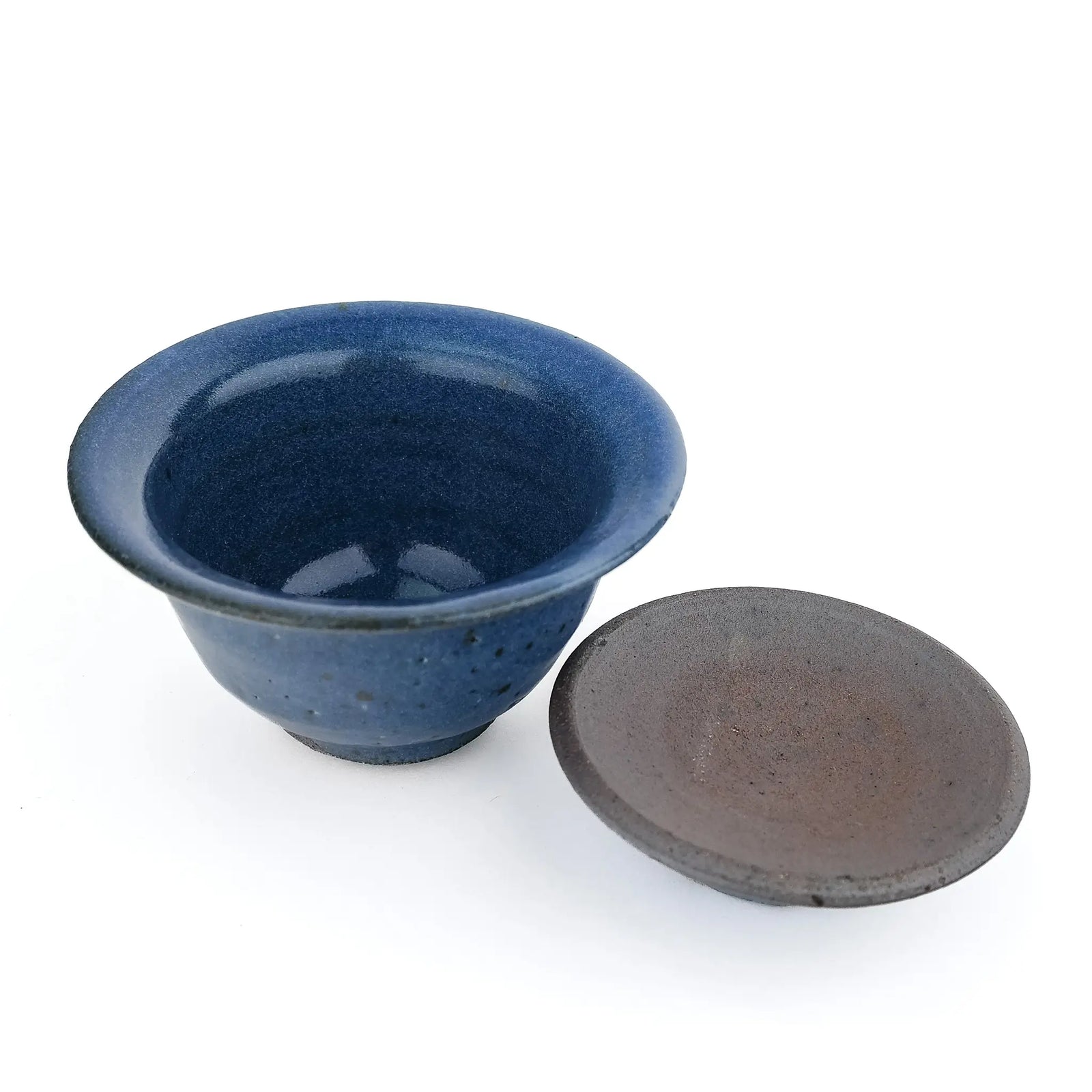 Mark Mohler handmade gaiwan #12 with the lid off and turned over beside the bowl, showing the blue glaze and throwing rings inside the bowl and the unglazed underside of the lid