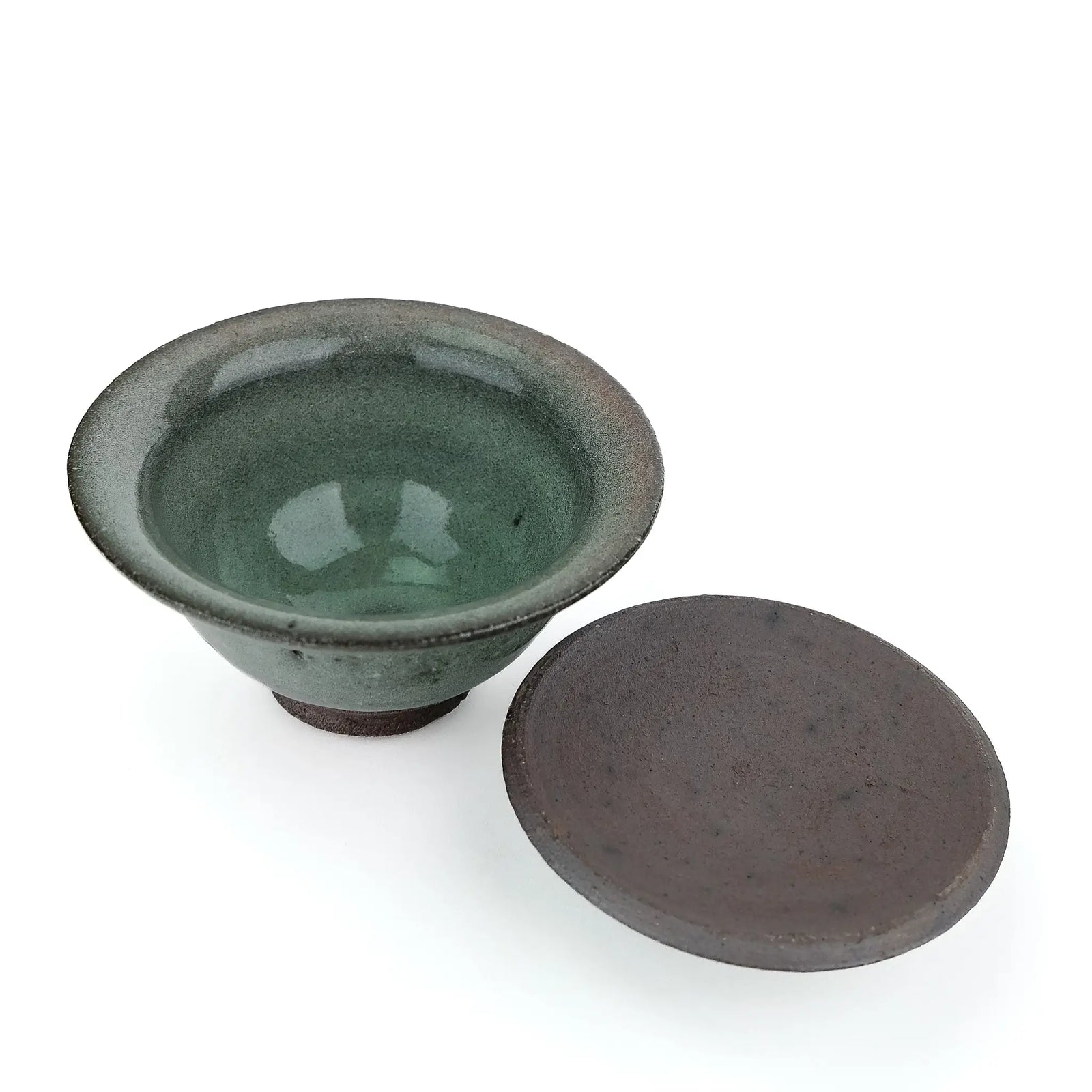 Mark Mohler handmade gaiwan #8 with the lid off and turned over beside the bowl, showing the glossy green glaze inside the bowl and the unglazed underside of the lid