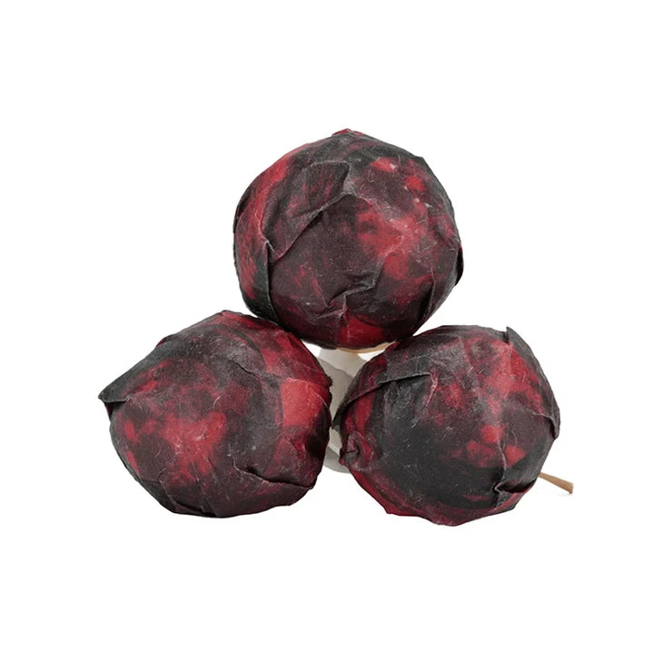 Three 2026 White2Tea Blood Moon minis stacked together in dark red and black mottled paper wrappers