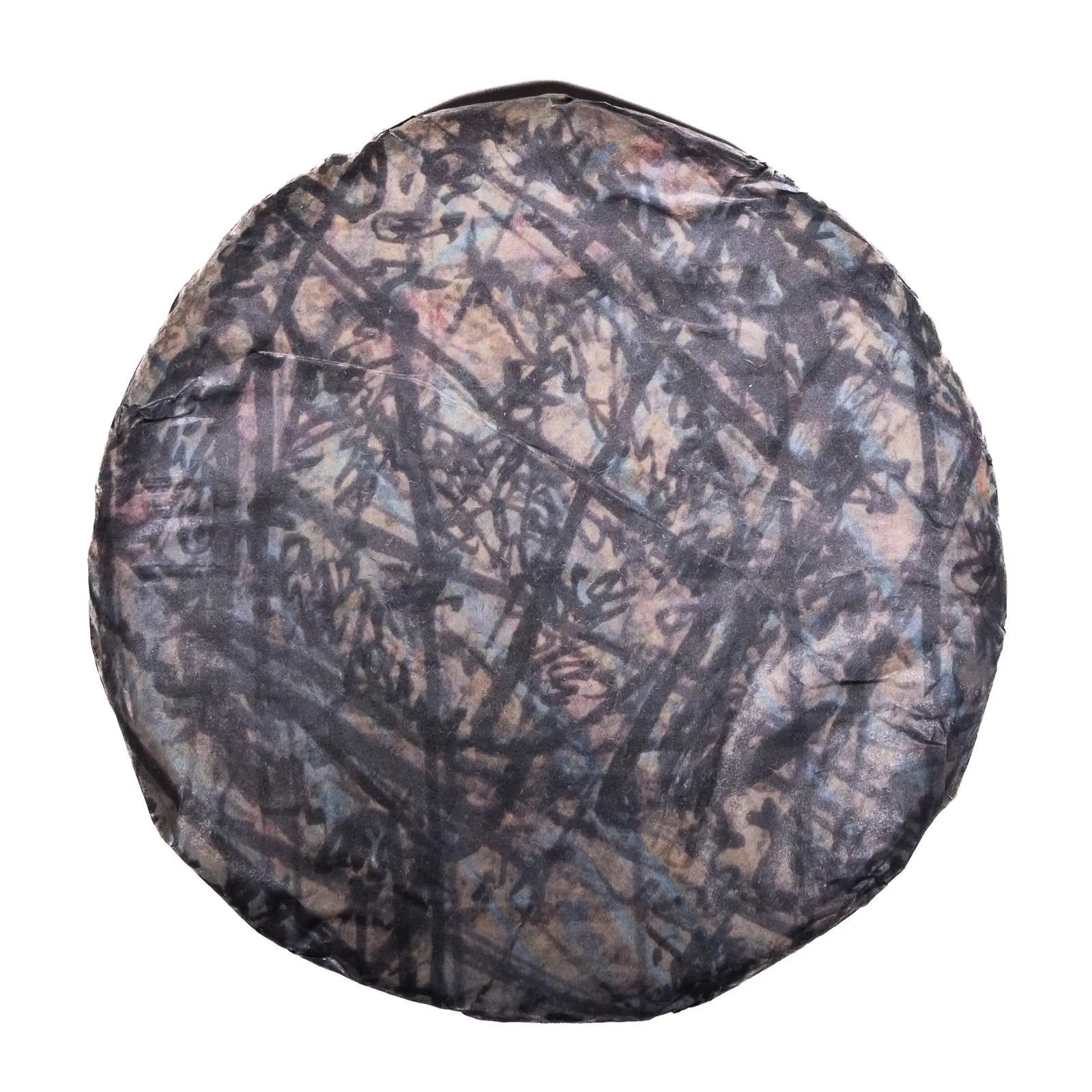 A cake of 2026 White2Tea Swerve Charcoal Roasted Black Tea on a white background