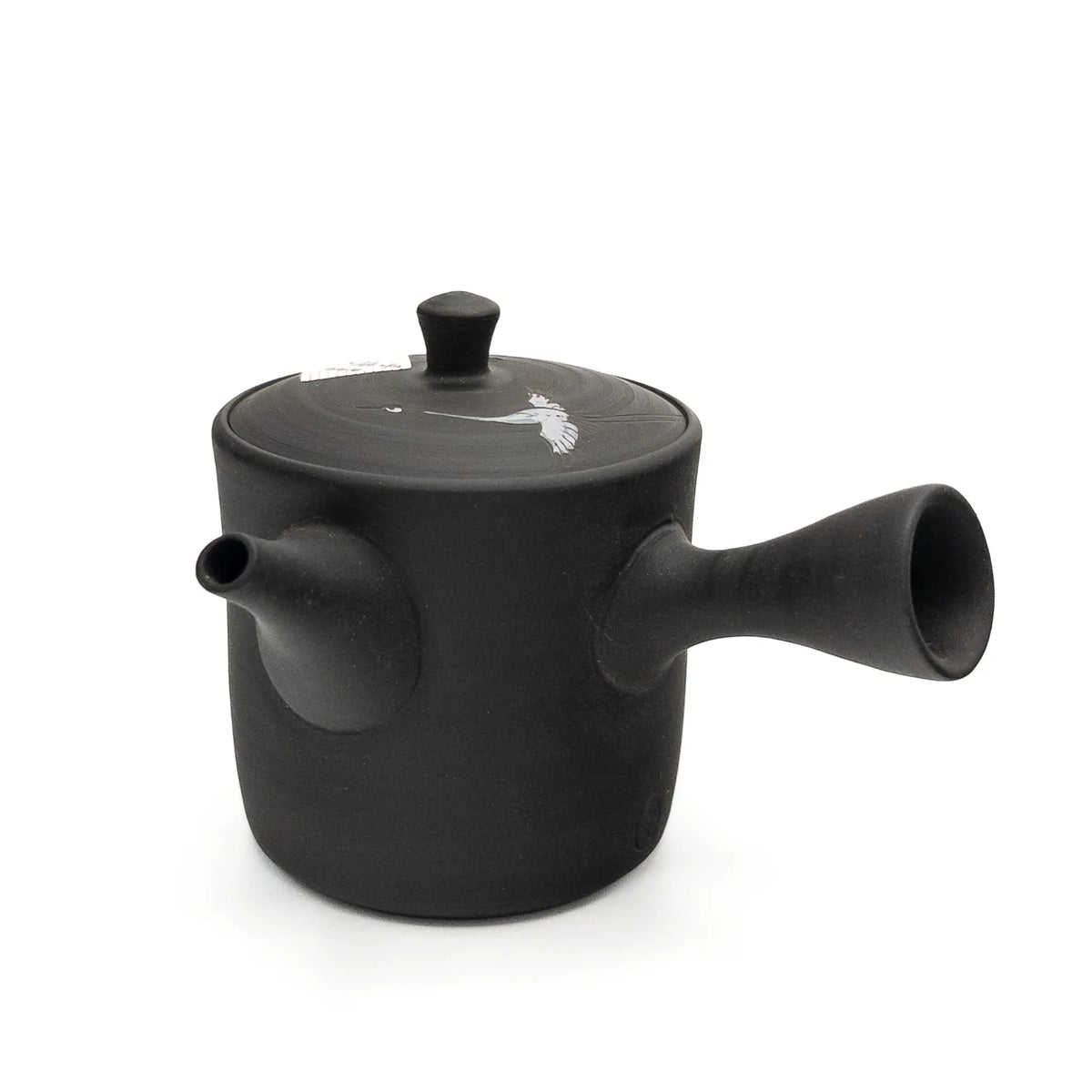 Black teapot with a lid on a white background