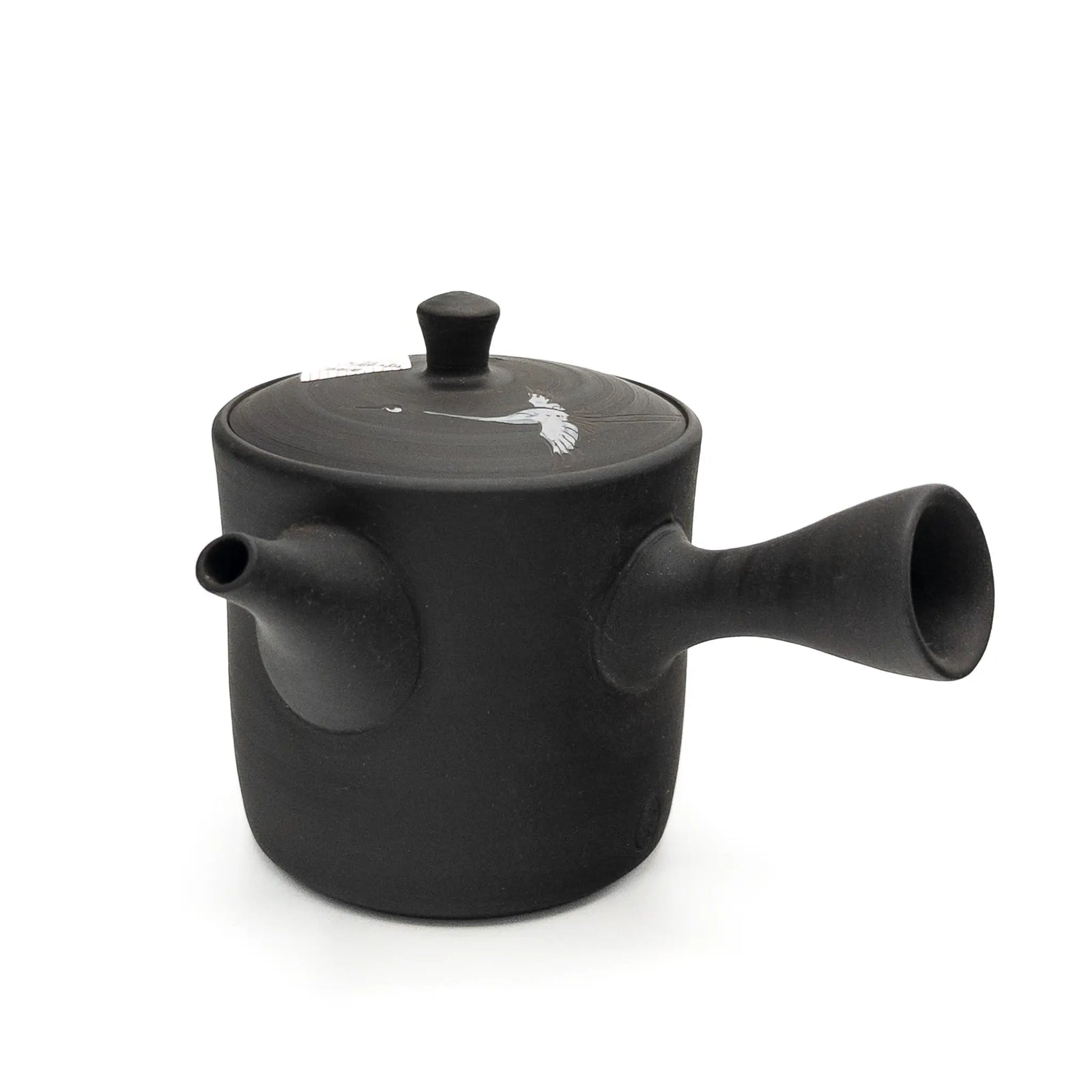 Black teapot with a lid on a white background