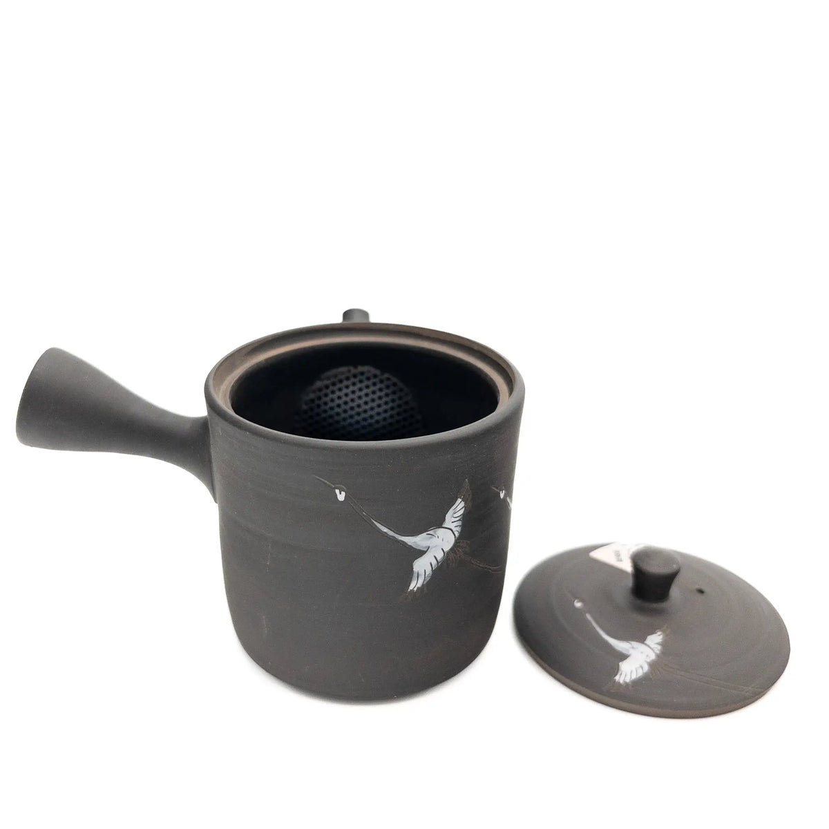 Black ceramic teapot with lid on a white background