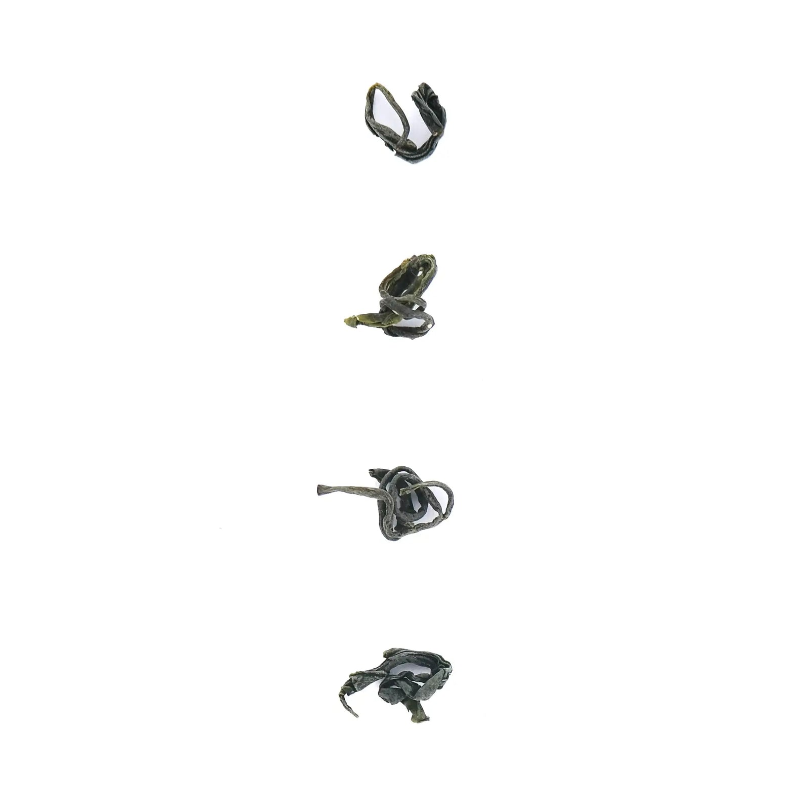 4 leaves of Chinese green tea against a white background