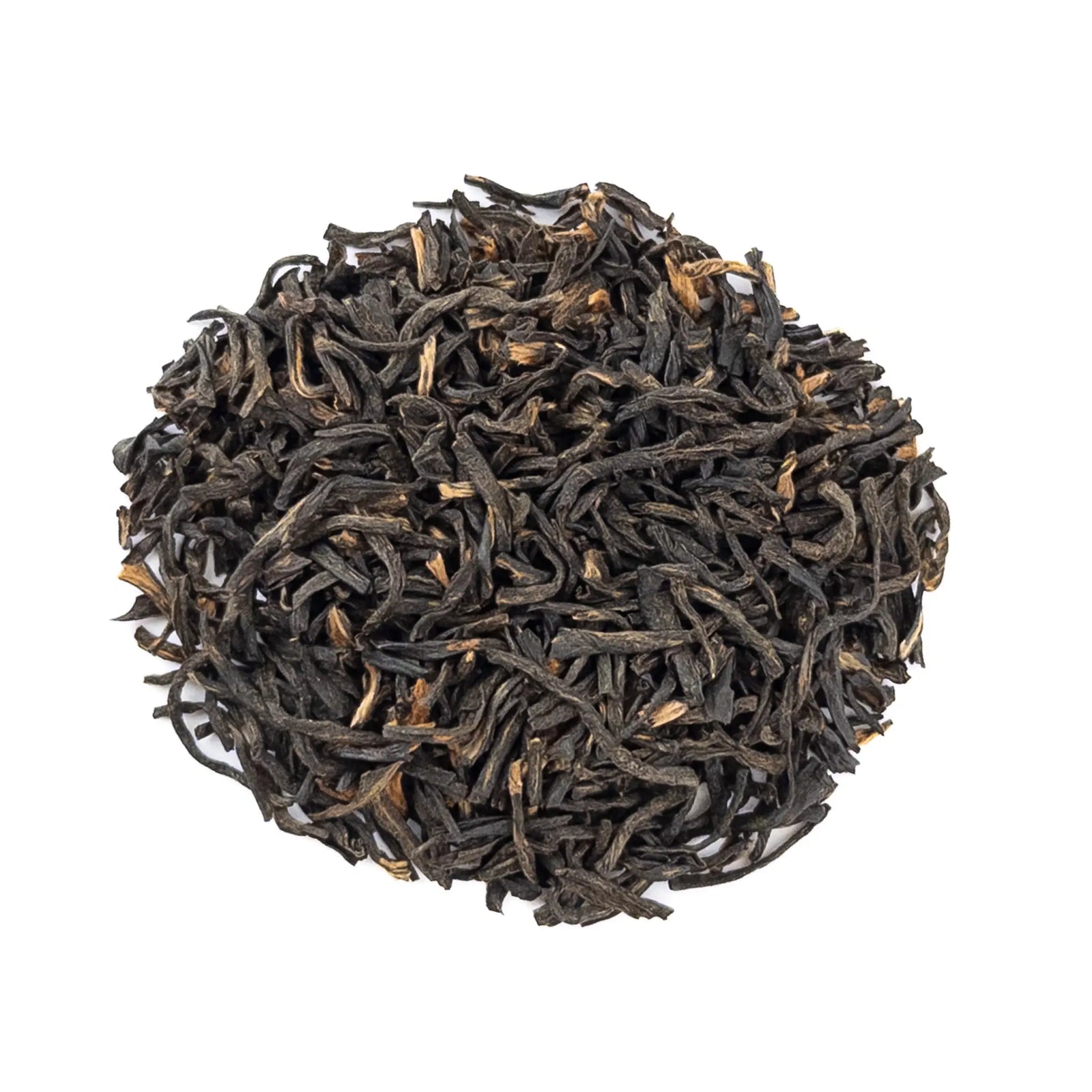 Black Assam tea leaves on a white background