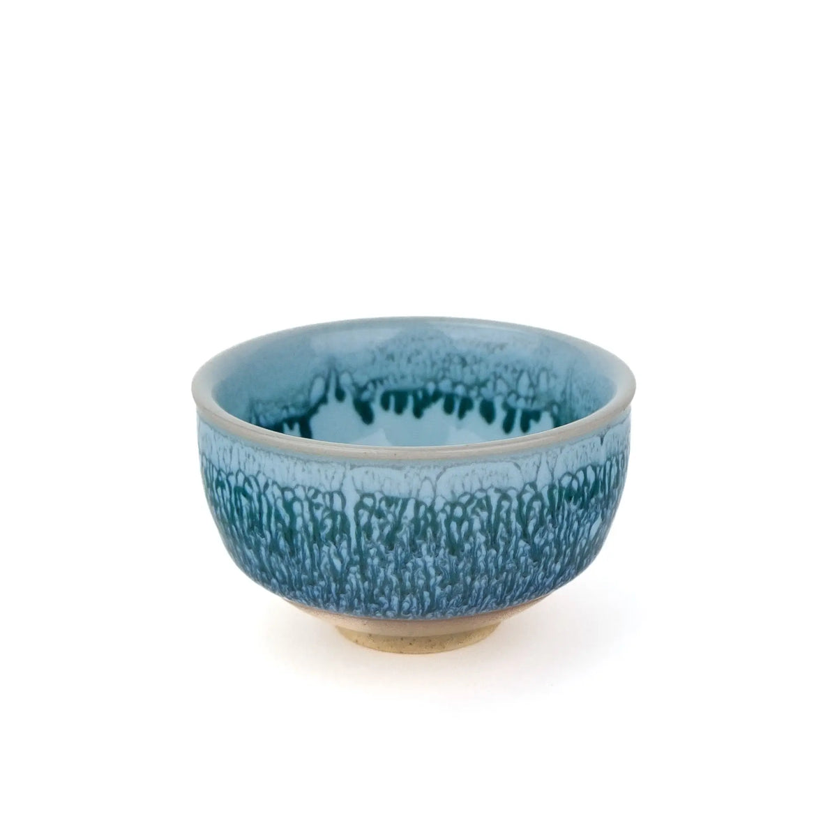 Huaning handmade cup #328 from slightly above, showing the glaze drips inside the cup