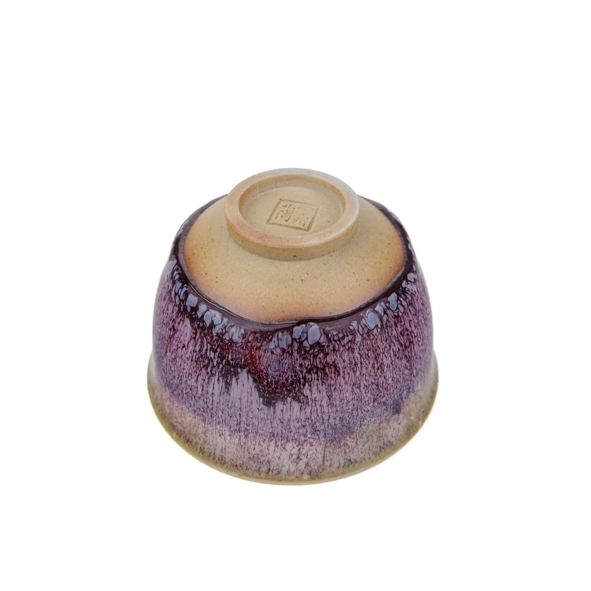 Underside view of Handmade Huaning Pottery Tea Cup for Gong Fu Tea - Variable Purple Glaze with an unglazed cup foot.  The artist's stamp is on the bottom  exterior of the cup.