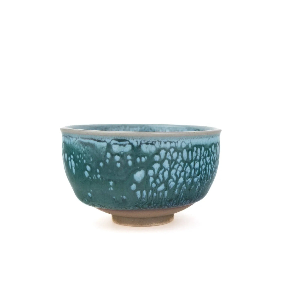 A ceramic tea cup with a textured, speckled teal and turquoise glaze, set against a plain white background.