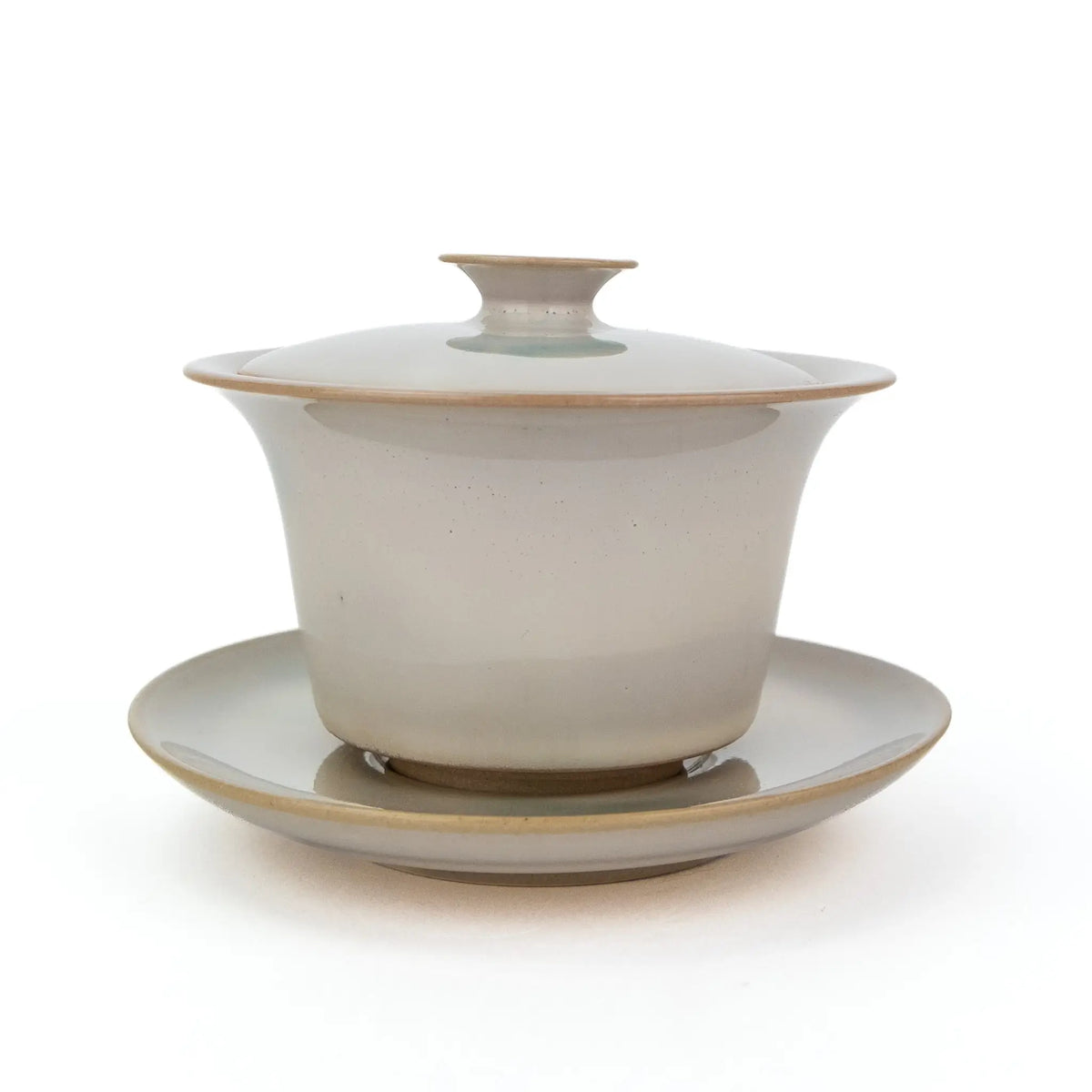 White Huaning Gaiwan with a little bit of blue in the glaze.  It comes with a saucer. 