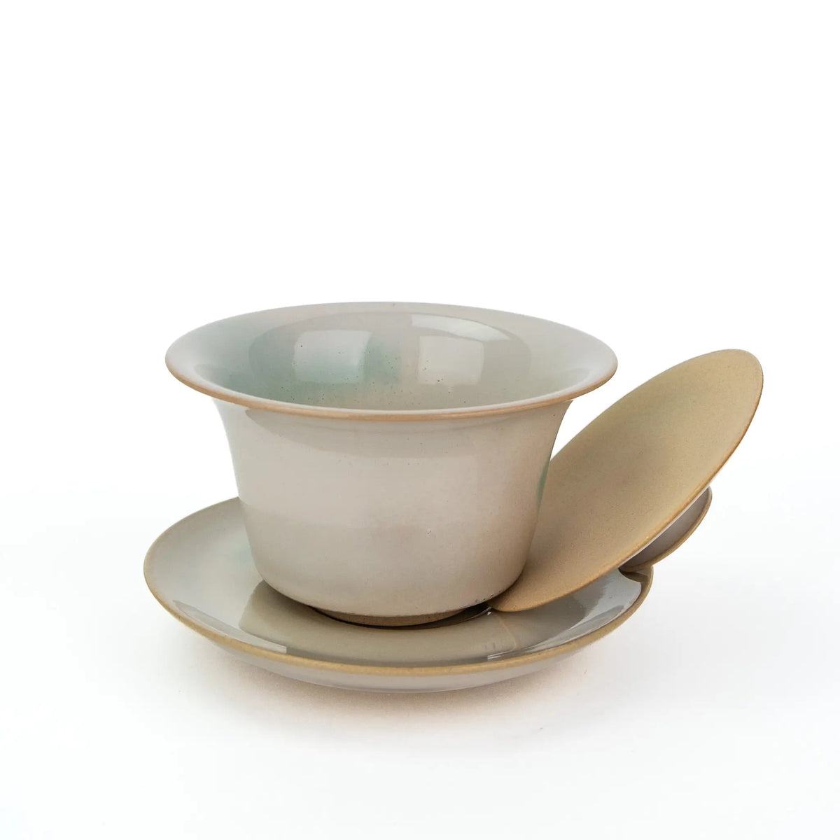 White Huaning Gaiwan with a little bit of blue in the glaze.  It comes with a saucer.   This show the lid off the bowl. 