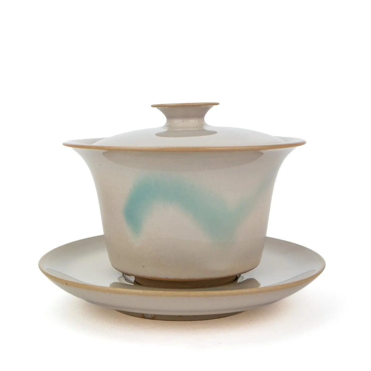 White Huaning Gaiwan with a little bit of blue in the glaze.  It comes with a saucer. 