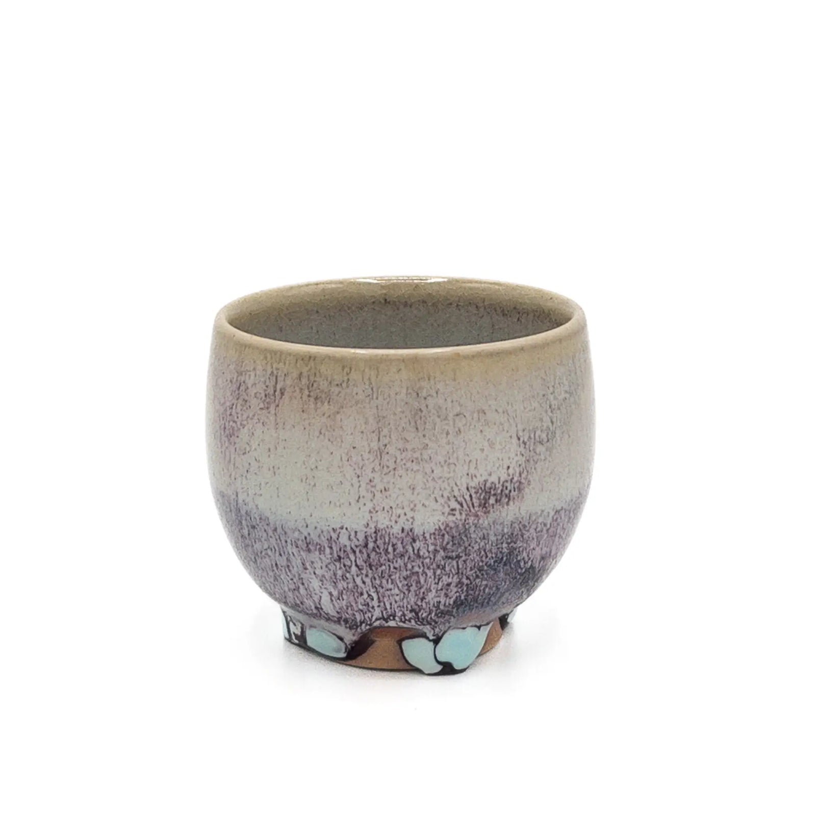 Ceramic cup with gradient color design on a white background