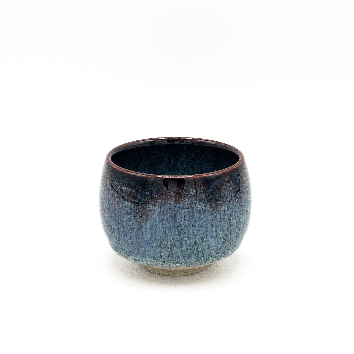 Blue ceramic cup on a white background