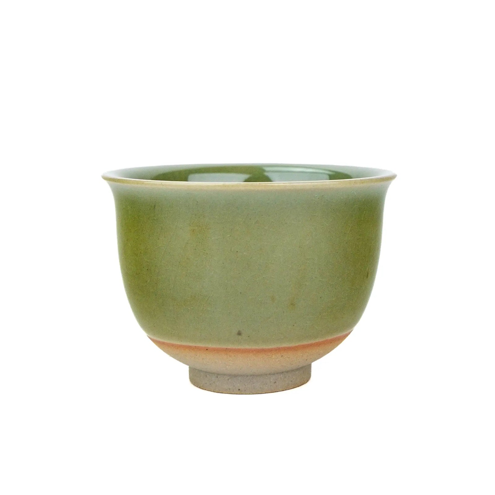 Huaning handmade cup #333 with a flared rim and green glaze, a warm orange band just above the unglazed clay foot