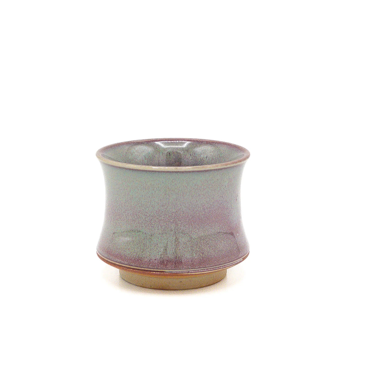 Ceramic cup with a gradient color from green to purple on a white background