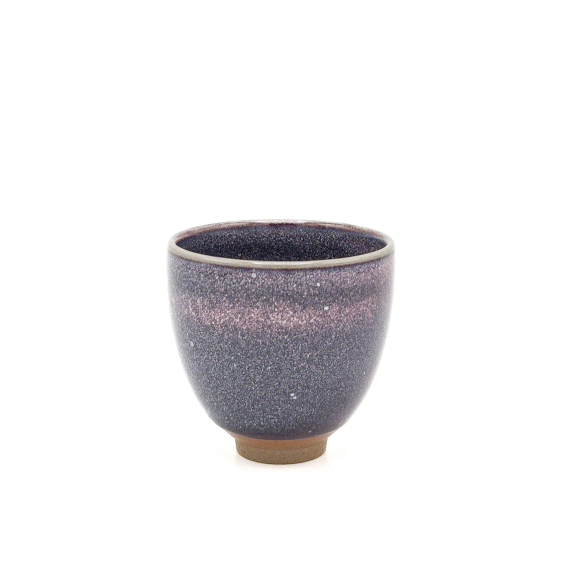 Speckled purple ceramic cup on a white background