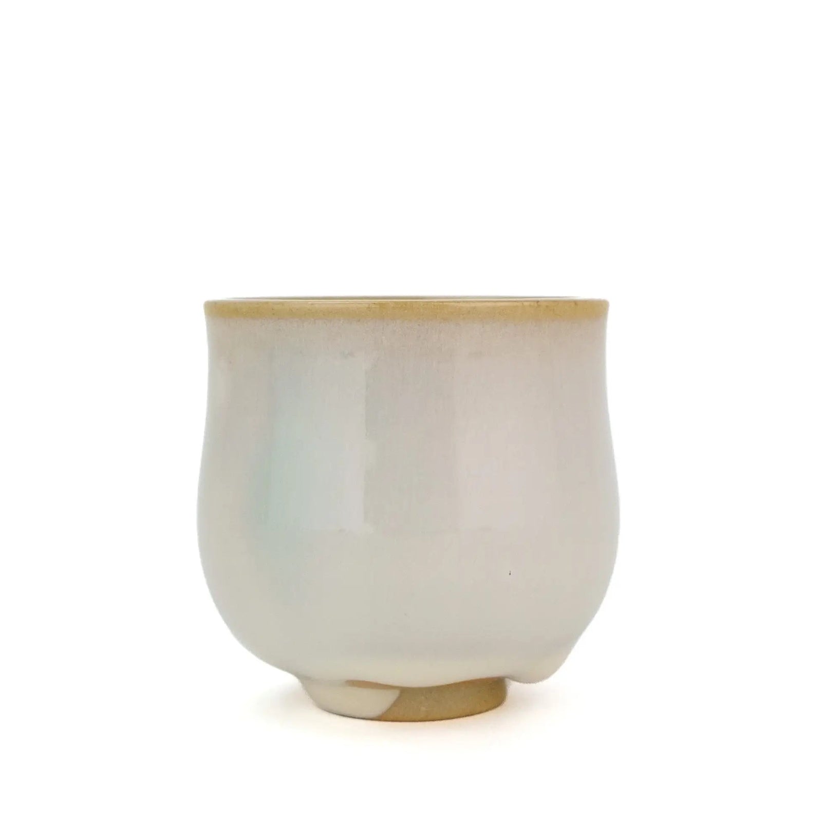 Huaning handmade cup #350, a tall rounded cup in white glaze with a faint blue-green streak and a tan rim