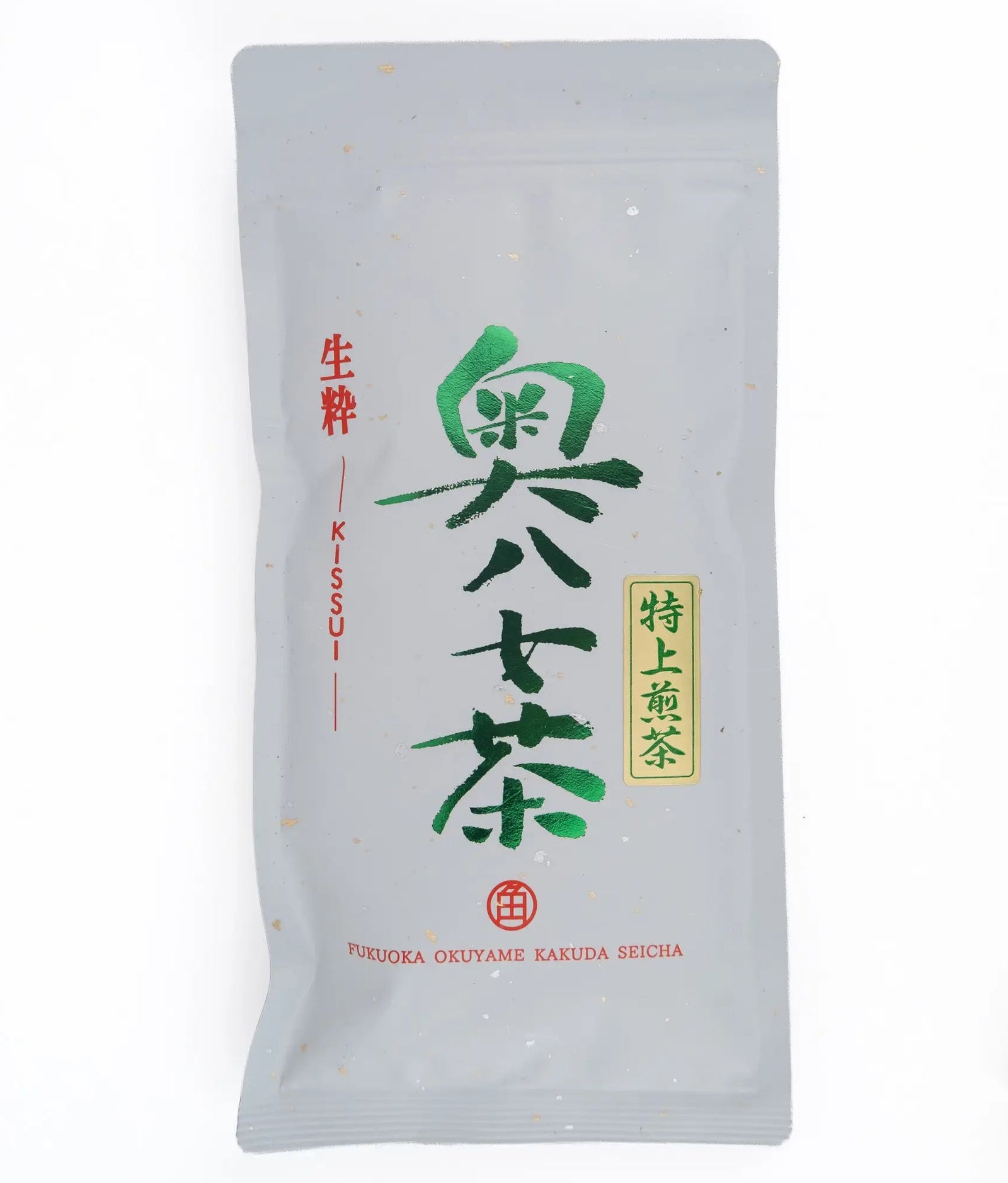 A single stand-up pouch of Japanese tea on a plain white background. The packaging is light gray with large green and red Japanese characters and a small gold label.