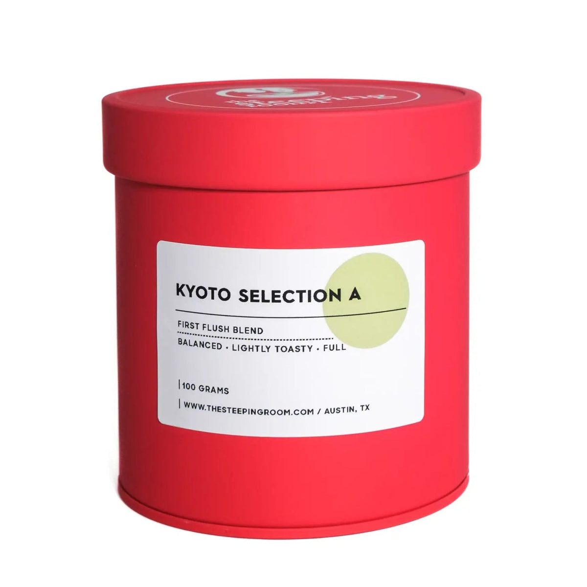 Red cylindrical matcha container with a white label on a white background
