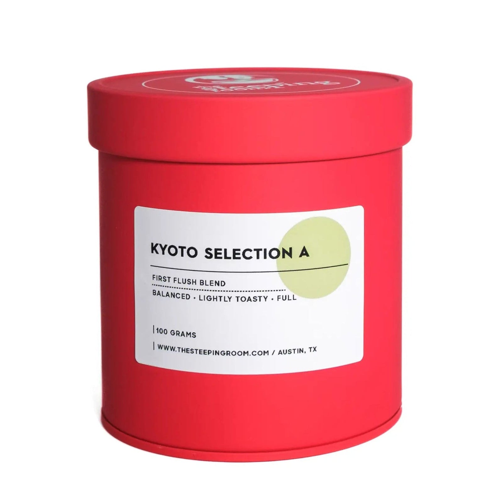 Red cylindrical matcha container with a white label on a white background