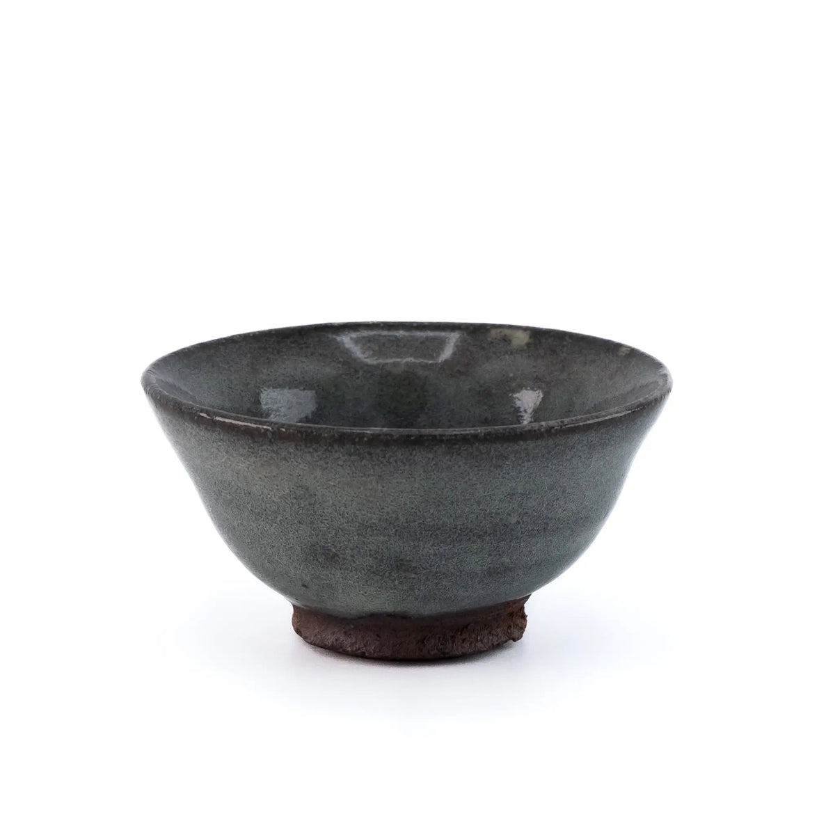 Ceramic cup with a speckled glaze on a white background