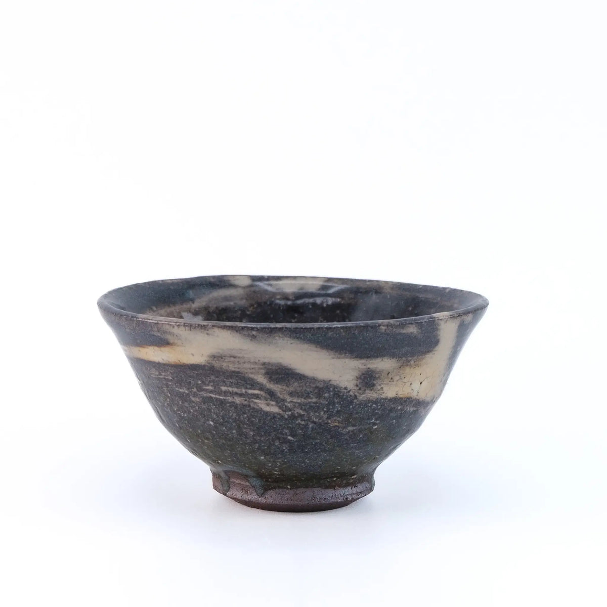 Black and white marbled ceramic tea cup on a white background