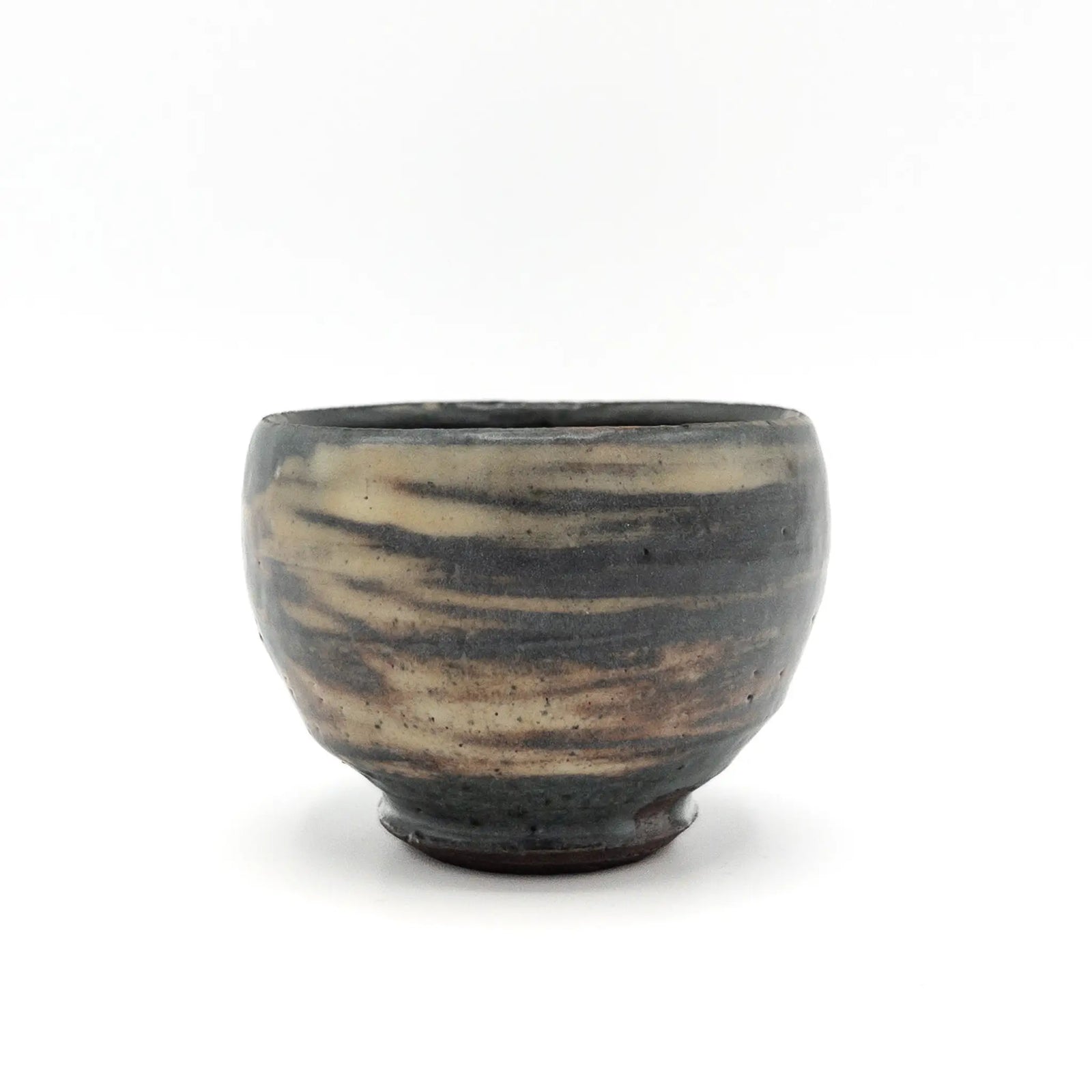 Ceramic cup with striped pattern on a white background