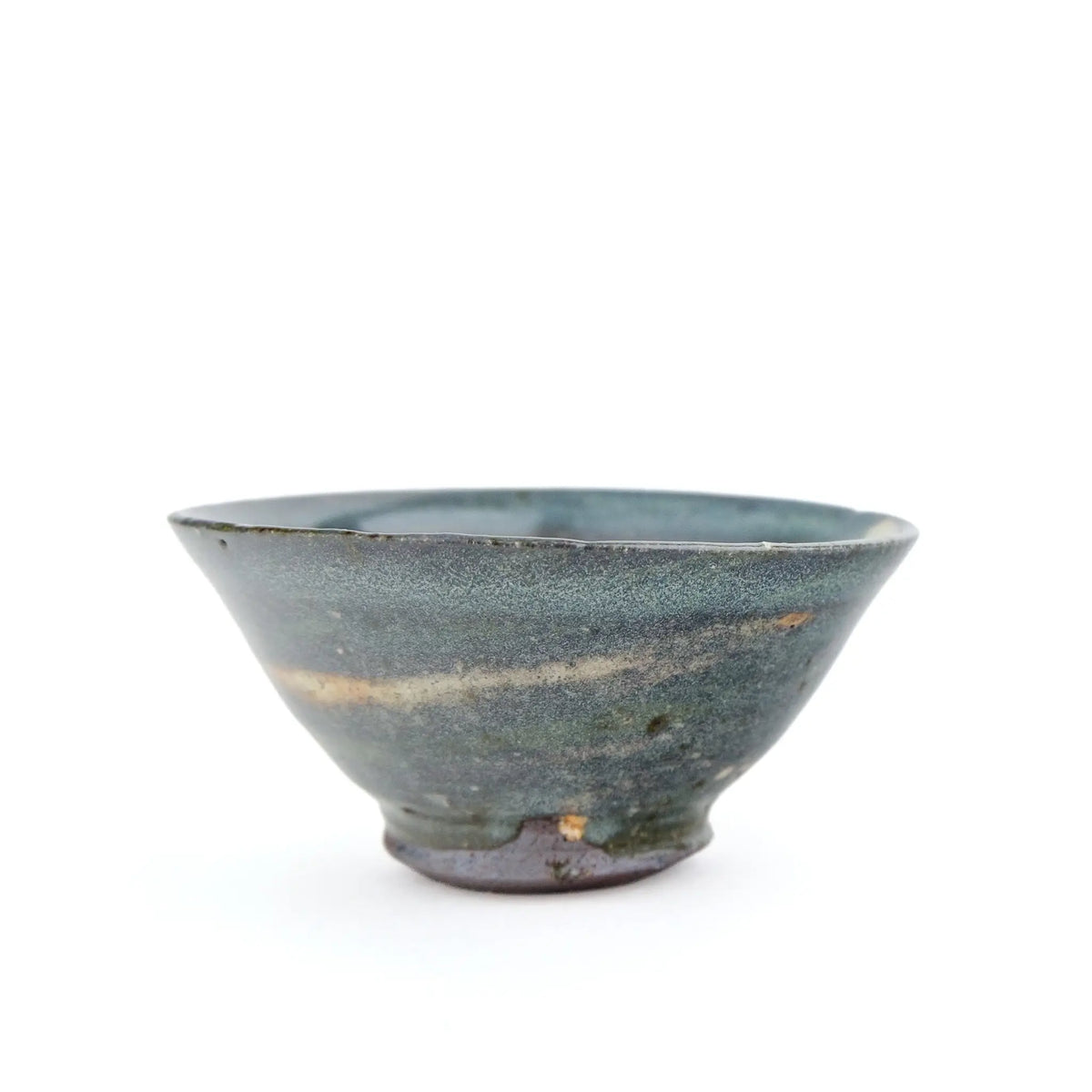A handmade ceramic gong fu teacuip with a textured, speckled glaze