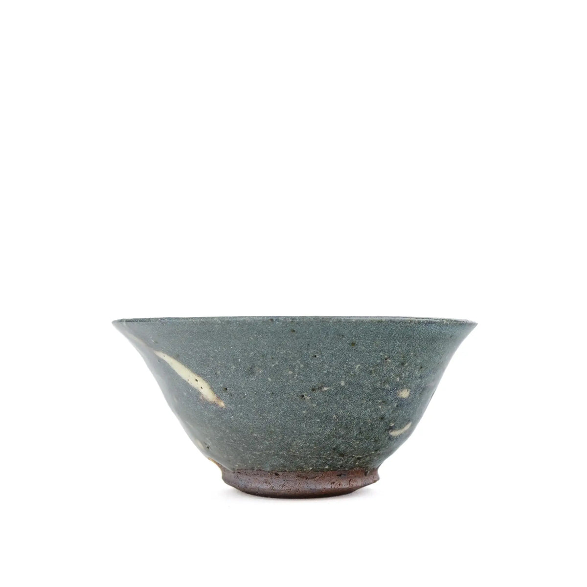 A handmade ceramic tea cup with a textured, speckled dark gray-green glaze and a rustic brown base, shown against a plain white background.