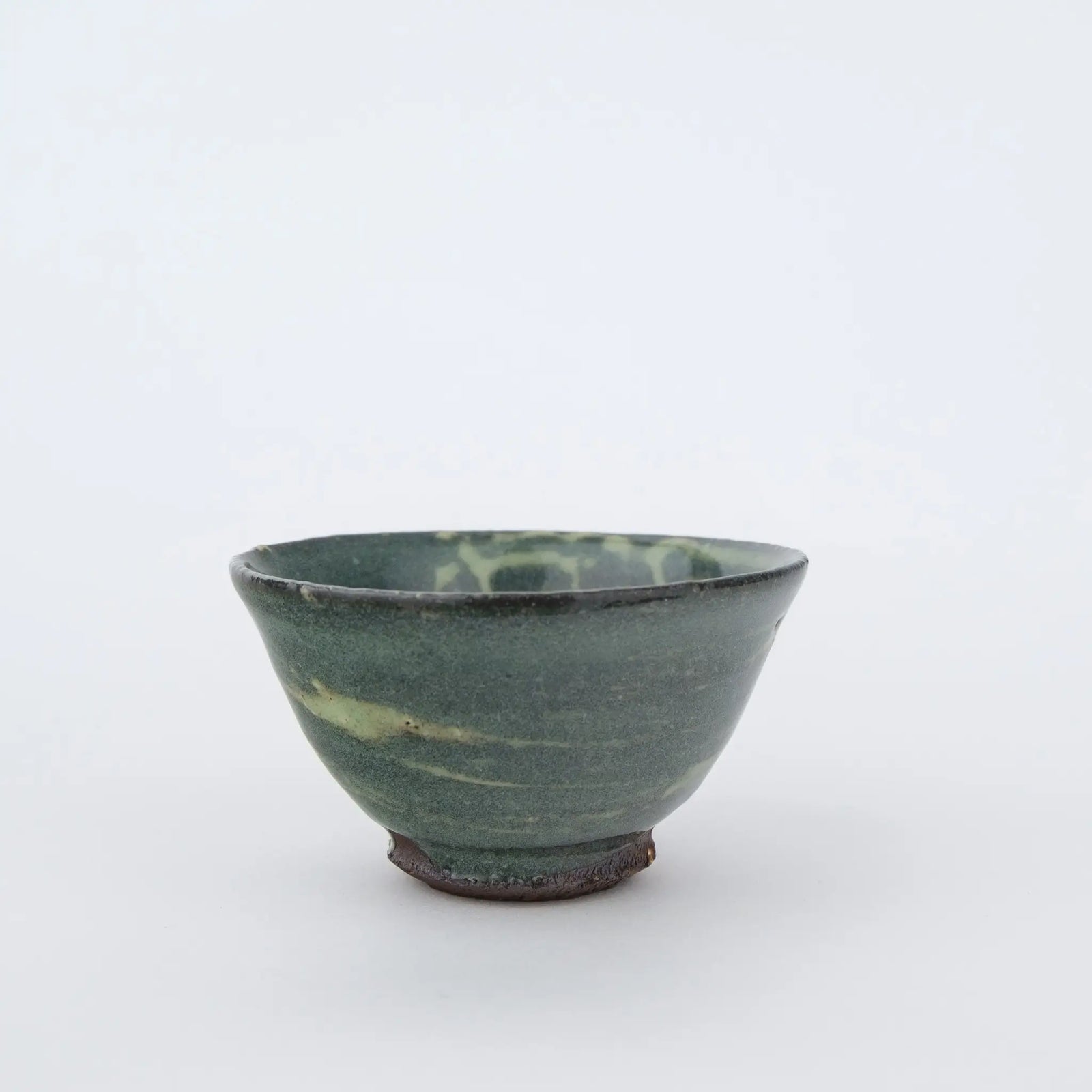 Ceramic teacup on a white background