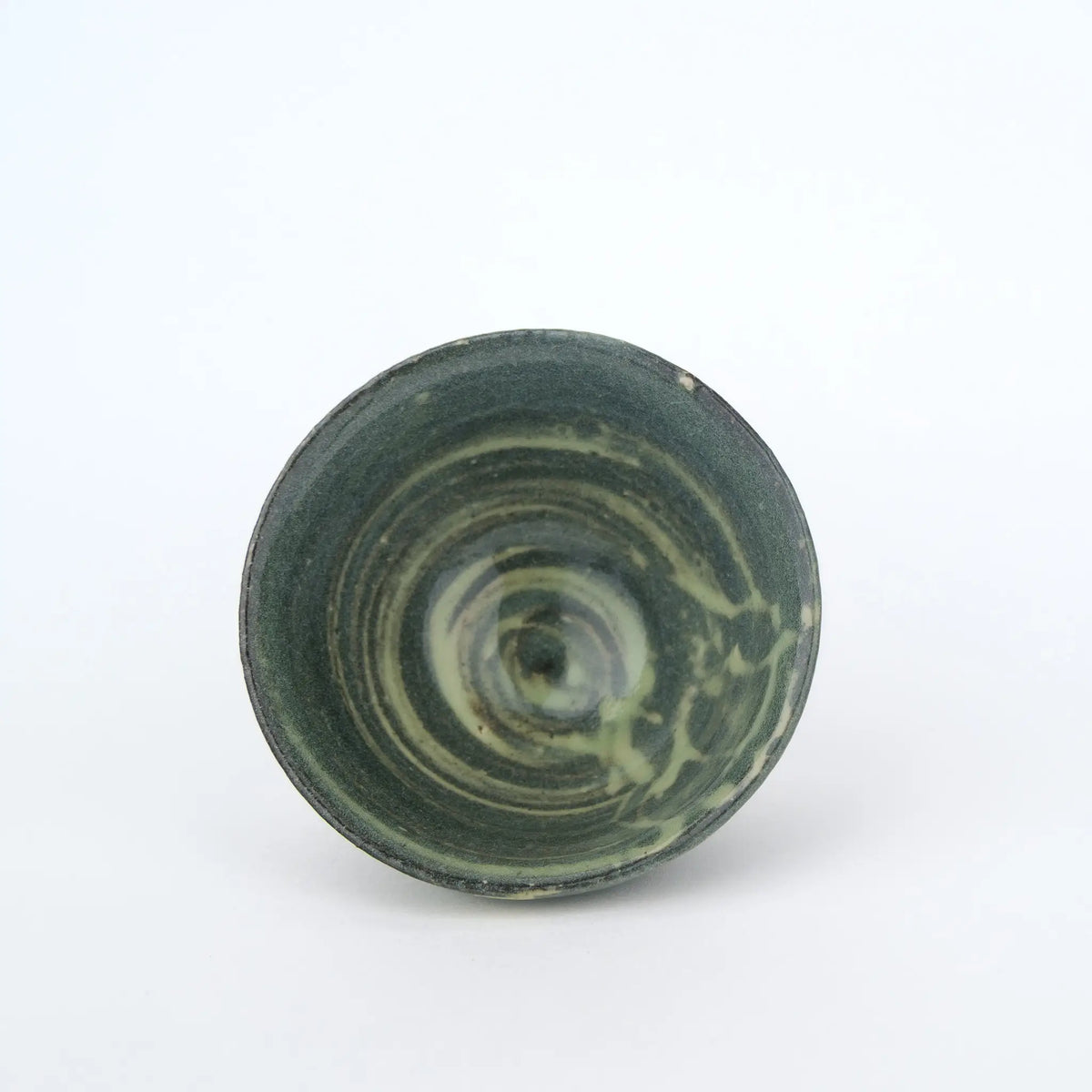Ceramic teacup on a white background - inside view
