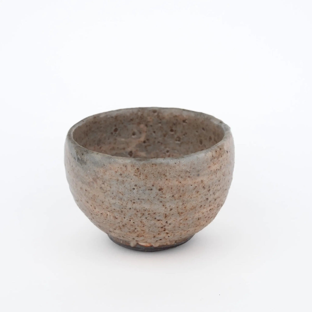 Handmade tea cup without a handle on a white background