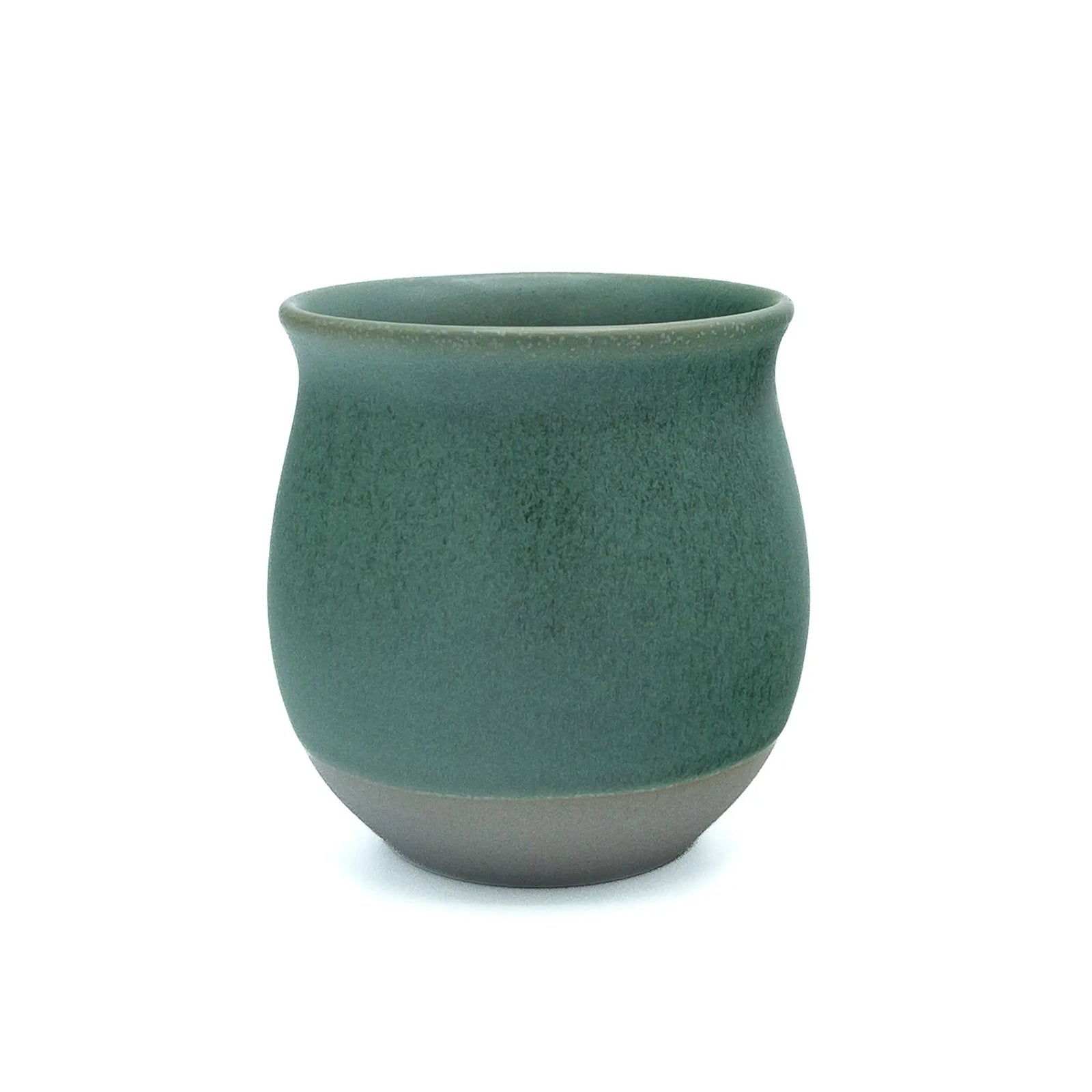 Origami Pinot flavor teacup in matte pine green with a tapered rim and unglazed foot