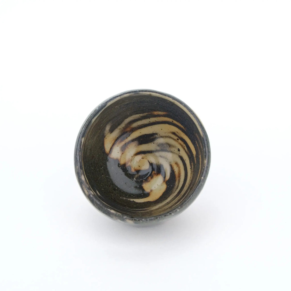 Ceramic cup with a unique glaze pattern on a white background - inside view