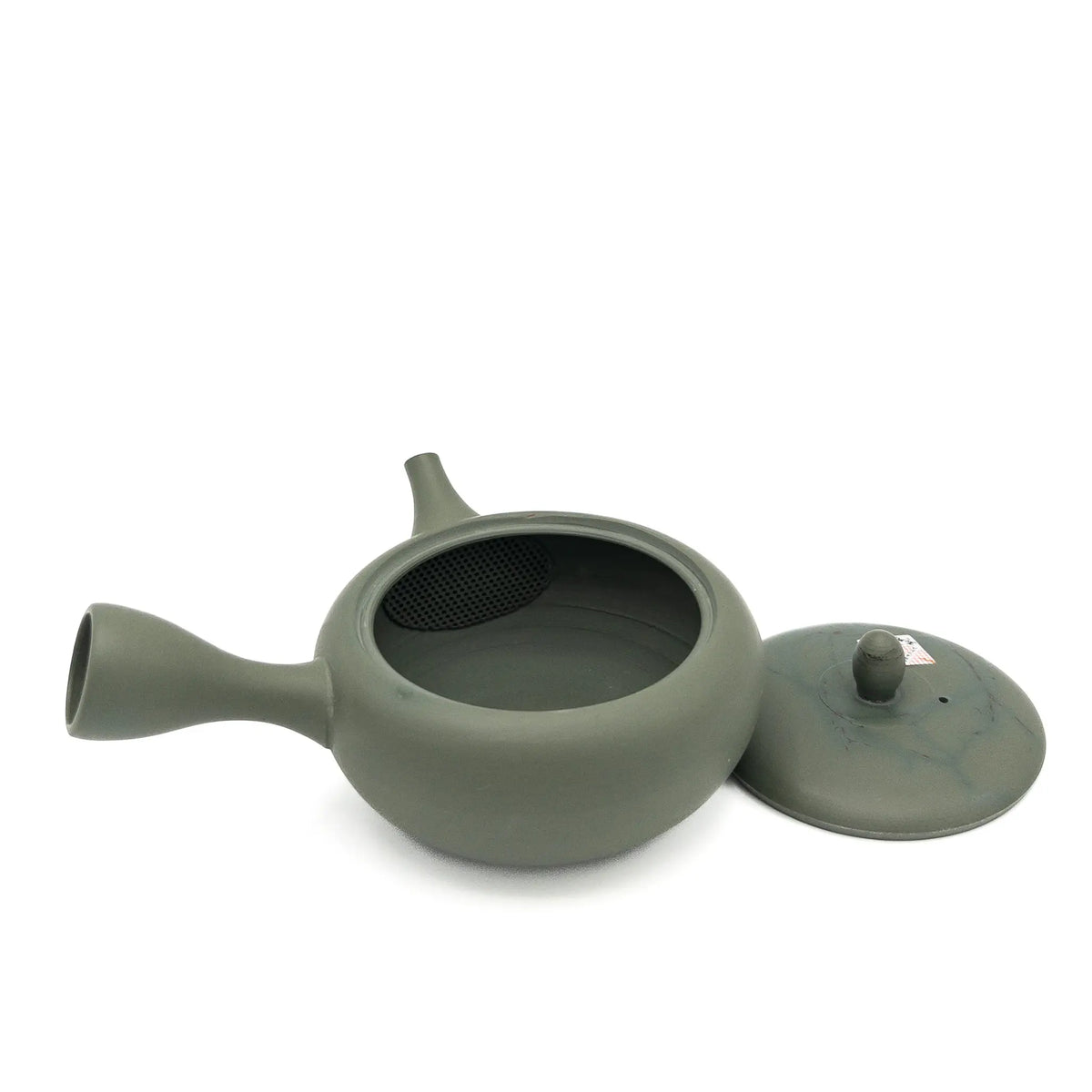 Green ceramic teapot with lid on a white background