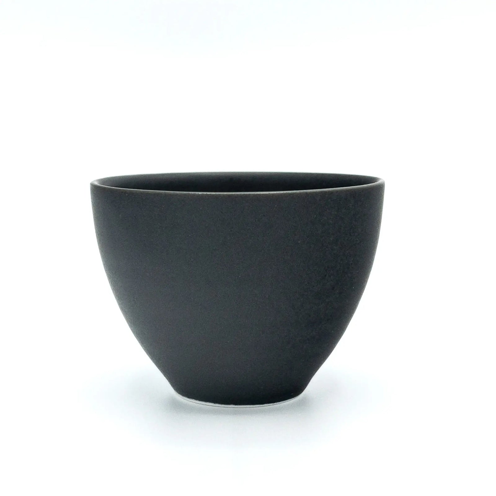 Black ceramic cup on a white background