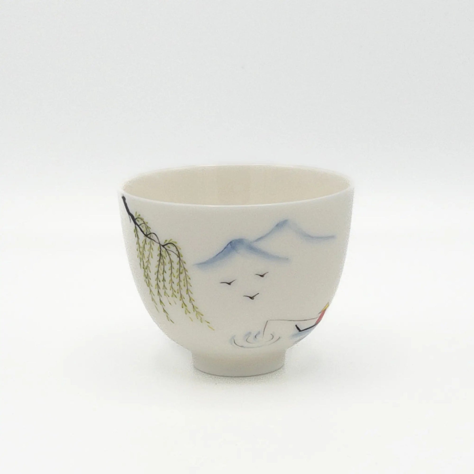 Ceramic cup with artistic designs on a white background