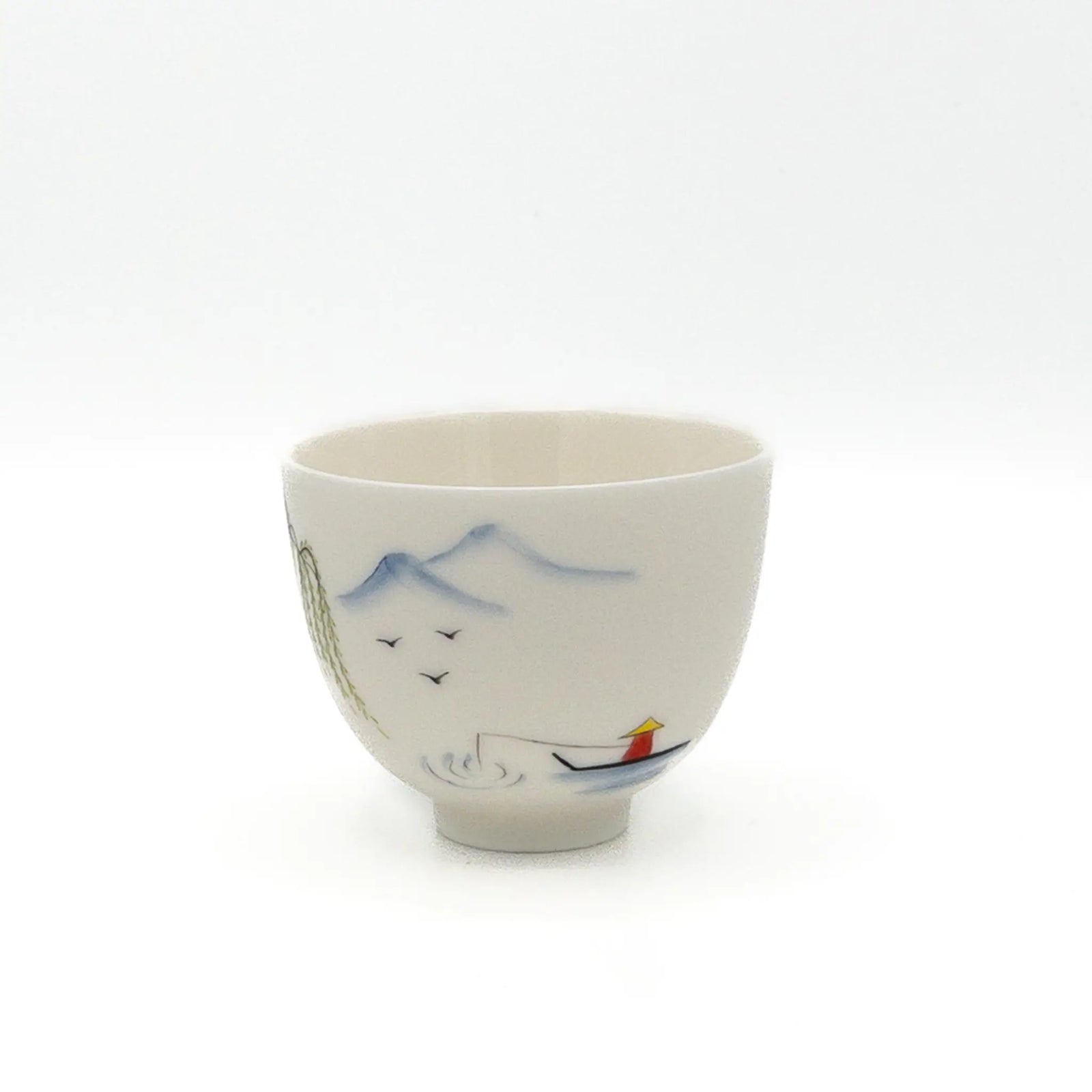 White ceramic cup with artistic designs on a white background