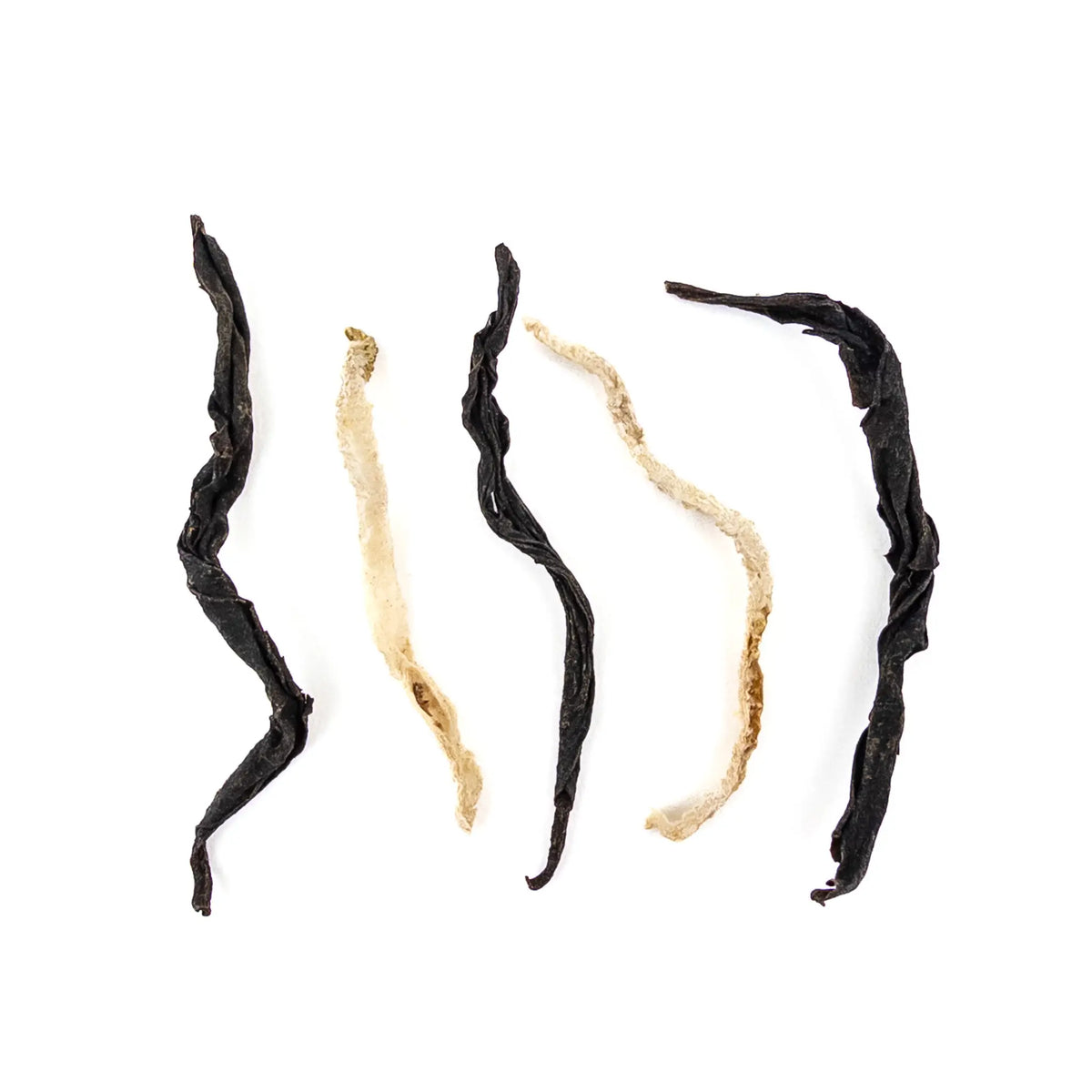 Black tea from Taiwan with Strips of Buddha's Hand Fruit on a white backgound